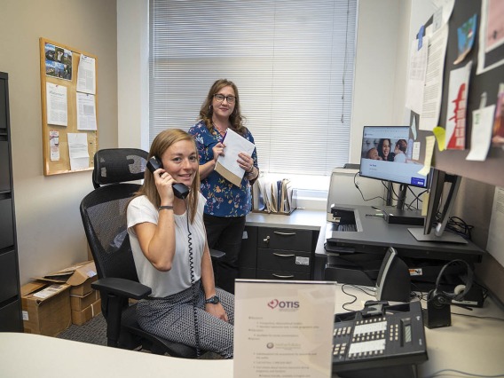 Genetic counseling graduate students providing information over the phone.