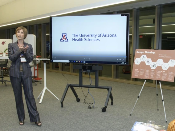 woman presenting a powerpoint slide