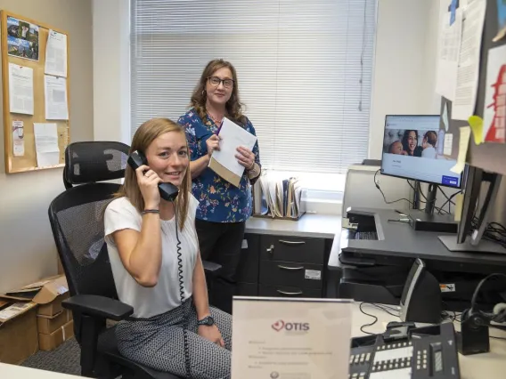 New UAGCGP Program Director, Chris Stallman, works with a GCGP student during a rotation in the MotherToBabyAZ pregnancy risk line.