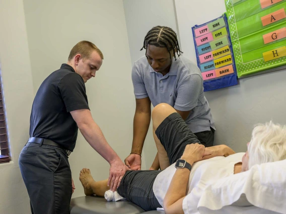 Lukas Barker, DPT, (left) works at Strive Physical Therapy in Tucson, a clinical partner for the College of Health Sciences’ developing PT program, which is expected to welcome its first class in fall 2025.