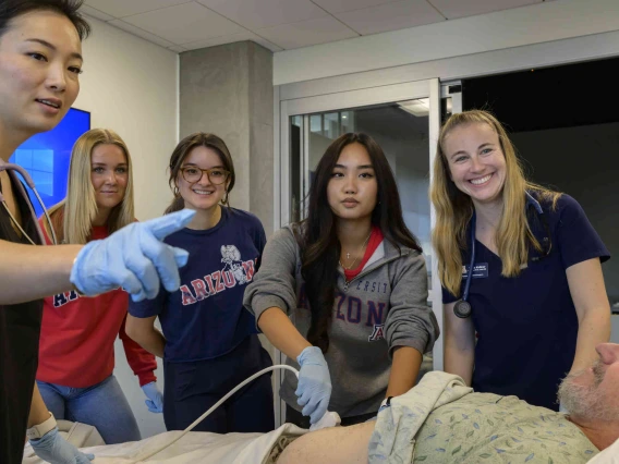 Physician assistant students in an simulation class with a patient
