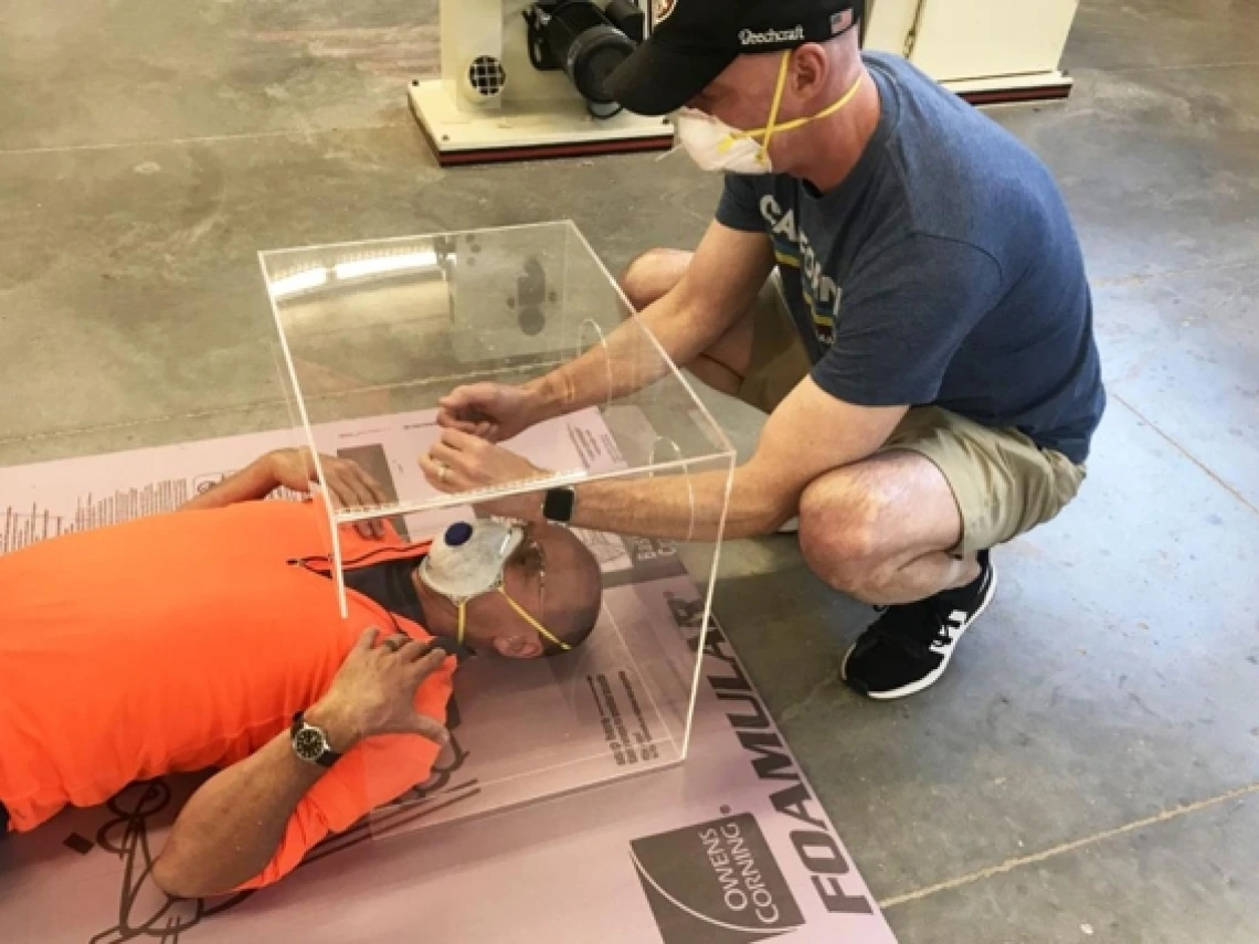 Users test a prototype for an intubation box