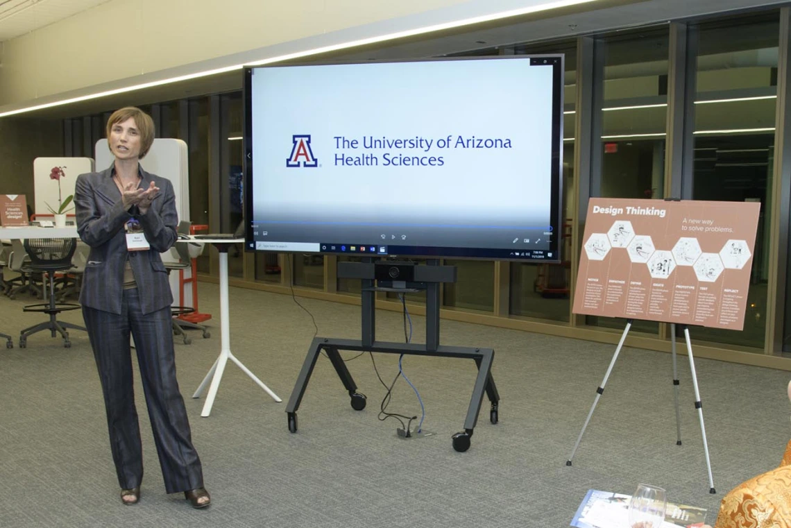 woman presenting a powerpoint slide